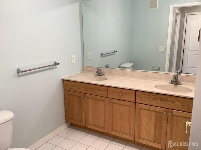 931 Cedar Ct, New Brunswick, NJ 08901 - bathroom with double vanity and tile patterned floors
