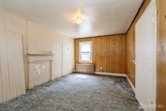 35 Kossman St, East Brunswick, NJ 08816 - unfurnished bedroom featuring radiator, carpet, and wood walls