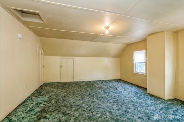 35 Kossman St, East Brunswick, NJ 08816 - additional living space with carpet floors, attic access, and vaulted ceiling