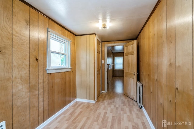 35 Kossman St, East Brunswick, NJ 08816 - hall featuring radiator, light wood-type flooring, and wooden walls