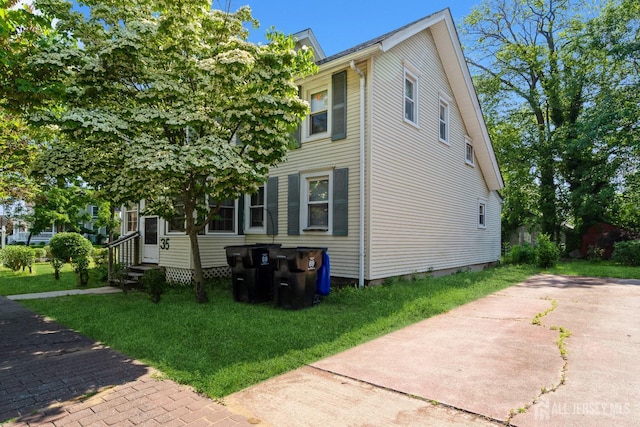 35 Kossman St, East Brunswick, NJ 08816 - view of property exterior featuring a lawn and entry steps