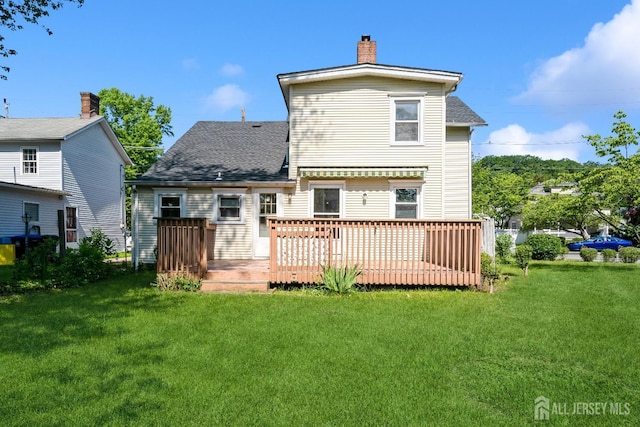 35 Kossman St, East Brunswick, NJ 08816 - back of house with a deck, a chimney, a yard, and a shingled roof