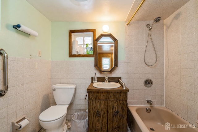 35 Kossman St, East Brunswick, NJ 08816 - bathroom featuring tile walls, bathing tub / shower combination, vanity, and wainscoting