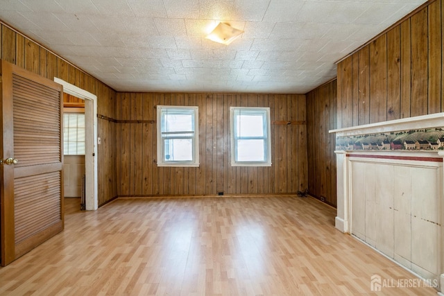 35 Kossman St, East Brunswick, NJ 08816 - empty room featuring light wood-type flooring and wooden walls