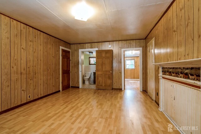 35 Kossman St, East Brunswick, NJ 08816 - empty room featuring light wood-style flooring and wood walls