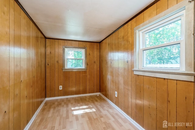 35 Kossman St, East Brunswick, NJ 08816 - unfurnished room featuring light wood finished floors and wood walls