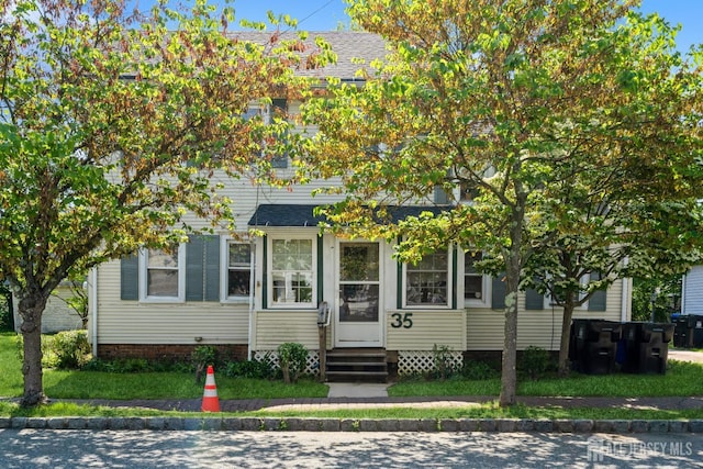 35 Kossman St, East Brunswick, NJ 08816 - view of property hidden behind natural elements featuring entry steps and a shingled roof