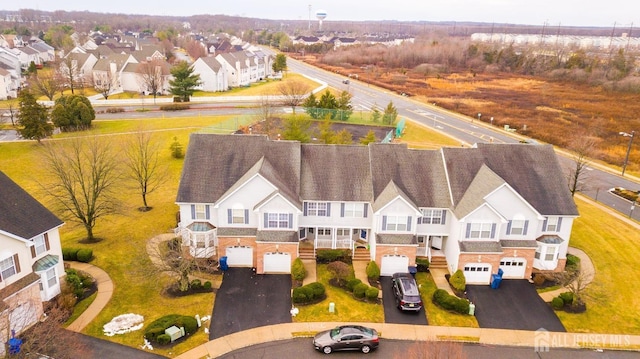 birds eye view of property with a residential view