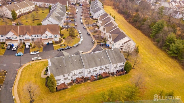 birds eye view of property with a residential view