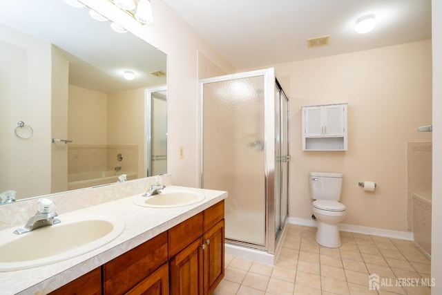 bathroom with tile patterned floors, visible vents, a stall shower, and a sink