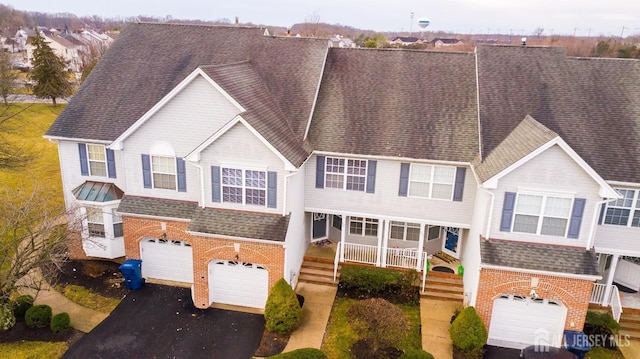 view of front of property featuring a garage and covered porch