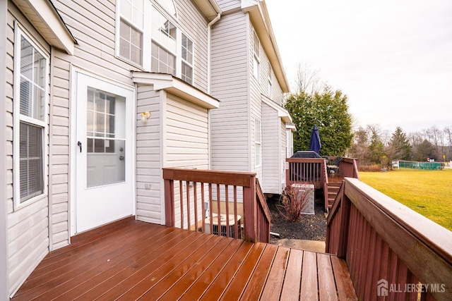 wooden terrace with a yard