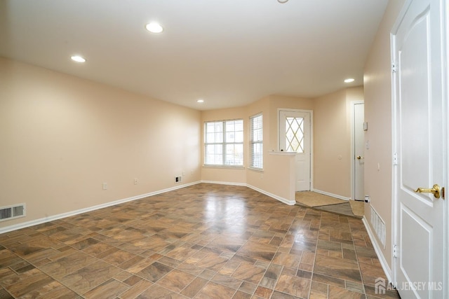 interior space featuring recessed lighting, visible vents, and baseboards