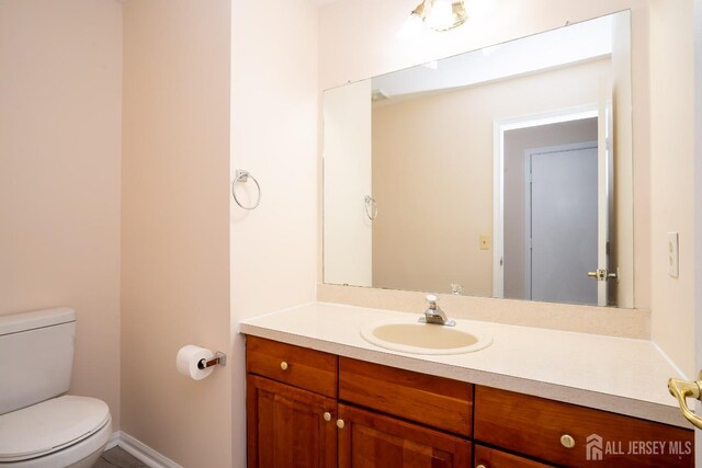 bathroom with vanity and toilet