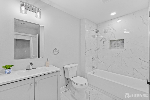 full bathroom with toilet, tiled shower / bath combo, and vanity