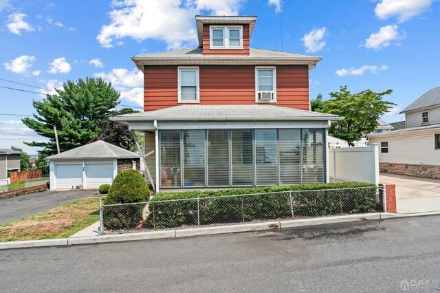 front of property featuring an outbuilding and a garage