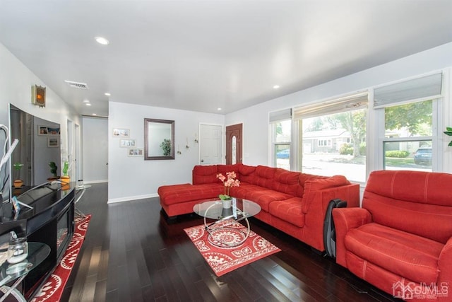 living room with dark hardwood / wood-style flooring