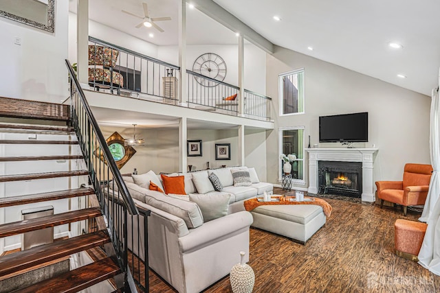 215 Kingsberry Dr, Franklin Twsp, NJ 08873 - living area featuring stairs, a fireplace with flush hearth, wood finished floors, ceiling fan, and high vaulted ceiling