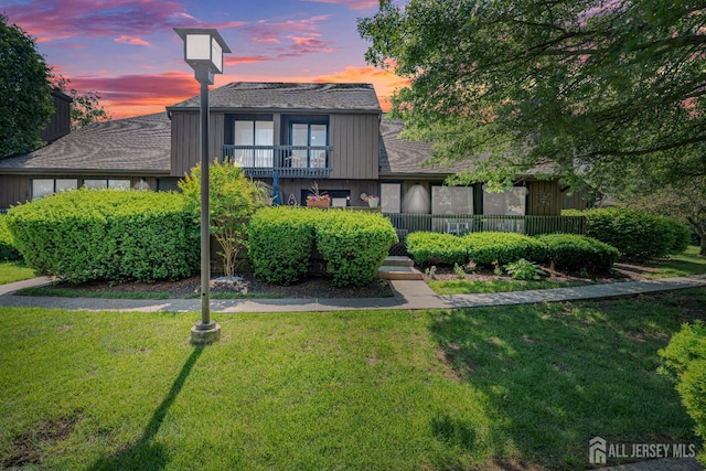 215 Kingsberry Dr, Franklin Twsp, NJ 08873 - view of front of property featuring a yard, a shingled roof, and a balcony