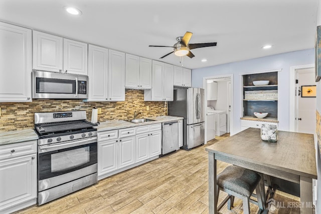 215 Kingsberry Dr, Franklin Twsp, NJ 08873 - kitchen featuring appliances with stainless steel finishes, separate washer and dryer, white cabinetry, ceiling fan, and recessed lighting