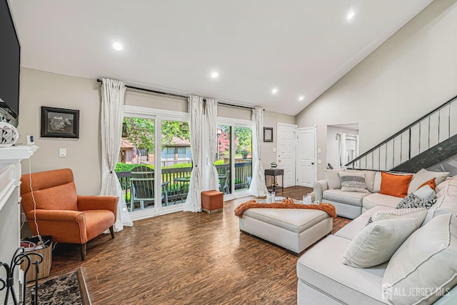 215 Kingsberry Dr, Franklin Twsp, NJ 08873 - living room featuring wood finished floors, stairs, a fireplace, lofted ceiling, and recessed lighting