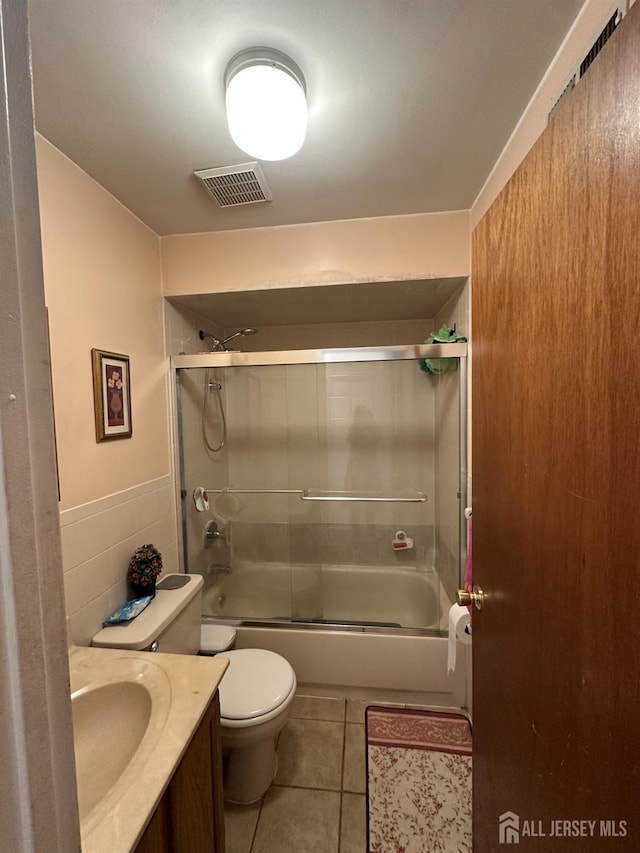 4215 Birchwood Ct, North Brunswick, NJ 08902 - bathroom featuring toilet, tile patterned flooring, vanity, and enclosed tub / shower combo