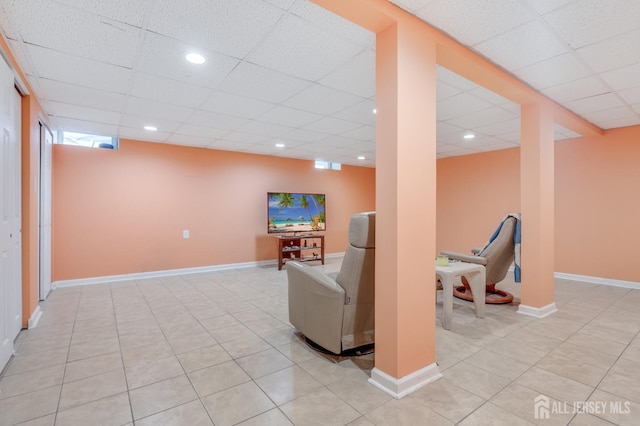 living area with light tile patterned floors, recessed lighting, a paneled ceiling, and baseboards