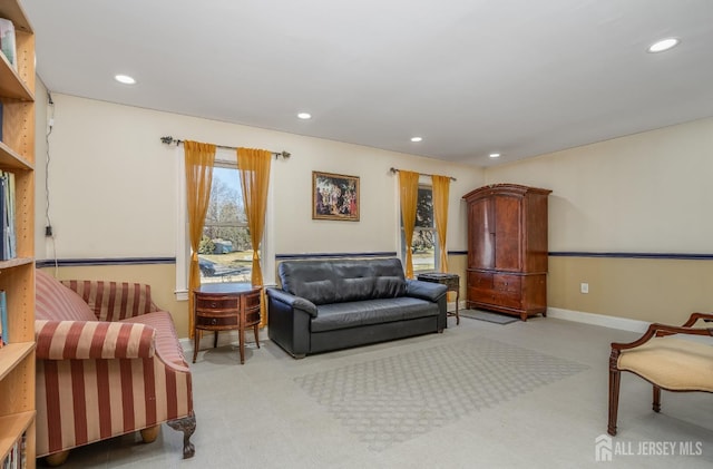 carpeted living room featuring recessed lighting and baseboards