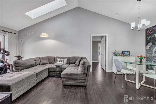 living room featuring baseboards, a chandelier, a skylight, high vaulted ceiling, and dark wood-style flooring