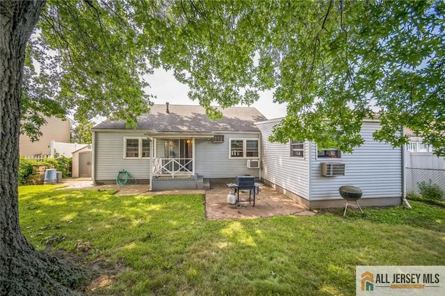 116 Whitman St, Carteret, NJ 07008 - rear view of house featuring a patio, a storage unit, a lawn, and cooling unit
