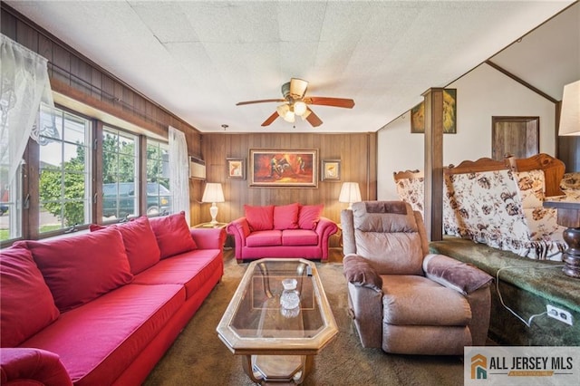 116 Whitman St, Carteret, NJ 07008 - living room featuring a ceiling fan, wooden walls, and carpet