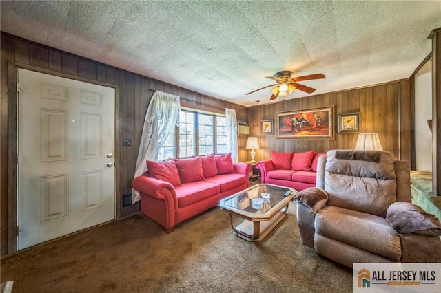 116 Whitman St, Carteret, NJ 07008 - carpeted living room featuring ceiling fan and wooden walls
