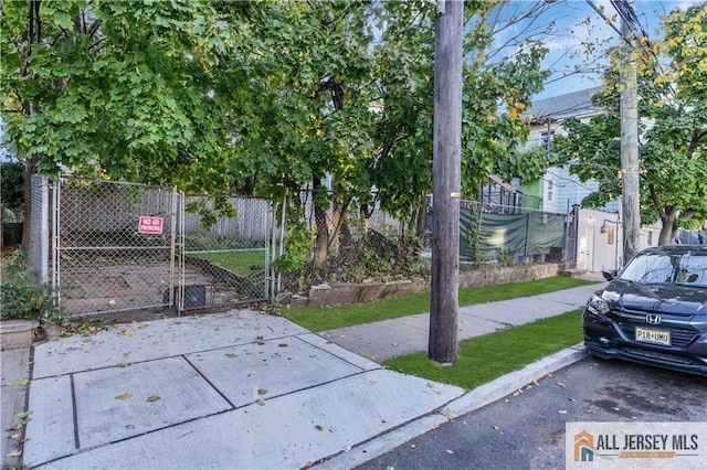 exterior space featuring a gate and fence