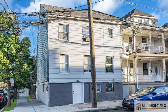 view of home's exterior featuring a balcony