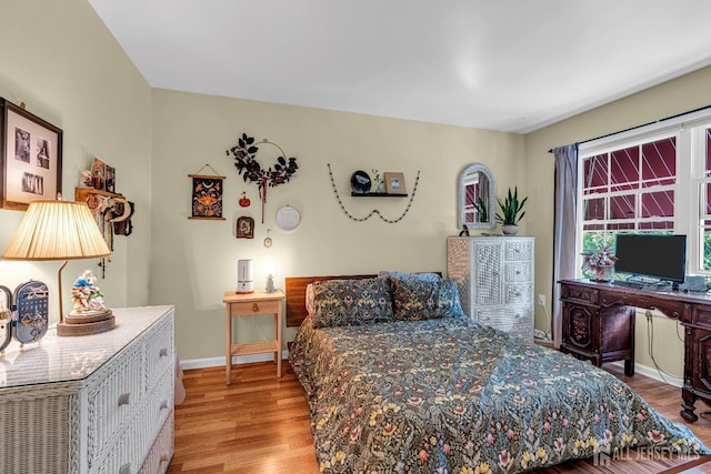 bedroom with light hardwood / wood-style floors