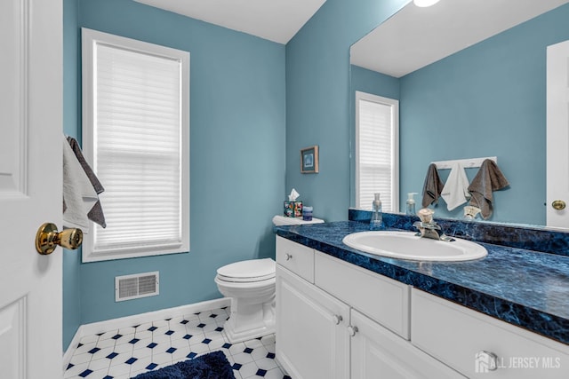 bathroom with vanity and toilet