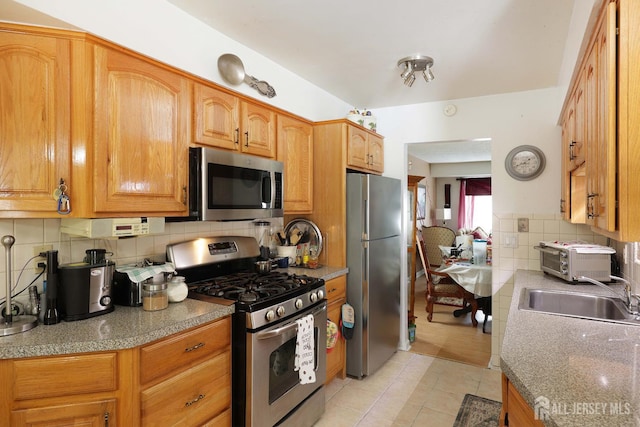 1-G Quincy Cir S, Brunswick, NJ 08810 - kitchen featuring stainless steel appliances, a sink, decorative backsplash, light tile patterned floors, and light countertops