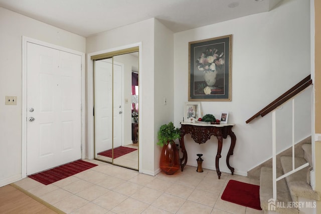 1-G Quincy Cir S, Brunswick, NJ 08810 - entryway featuring stairs, baseboards, and light tile patterned floors