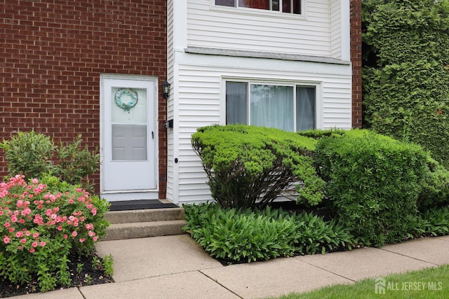 1-G Quincy Cir S, Brunswick, NJ 08810 - doorway to property with brick siding