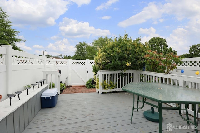 1-G Quincy Cir S, Brunswick, NJ 08810 - wooden terrace with a fenced backyard, a gate, and outdoor dining area
