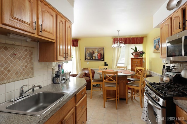 1-G Quincy Cir S, Brunswick, NJ 08810 - kitchen with a sink, stainless steel appliances, decorative backsplash, dark countertops, and plenty of natural light