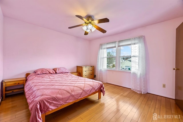 bedroom featuring a ceiling fan and wood finished floors