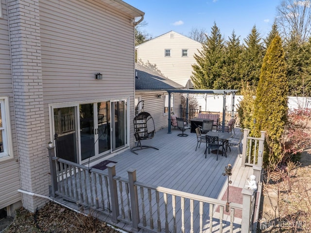 deck featuring outdoor dining area