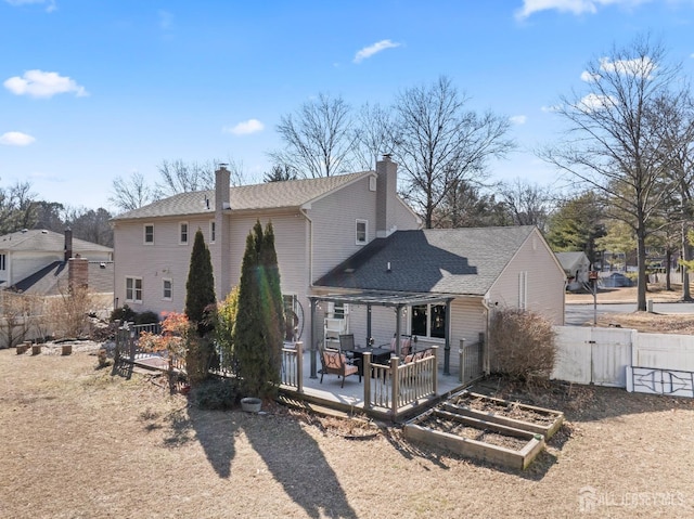 back of property featuring fence, a vegetable garden, a residential view, a pergola, and a chimney