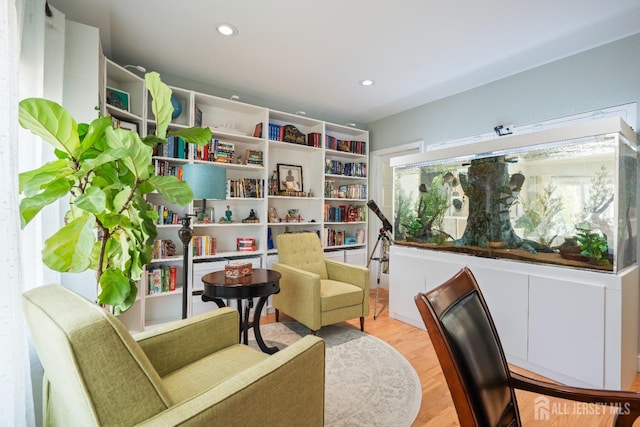 sitting room with a healthy amount of sunlight, light wood-style floors, and recessed lighting