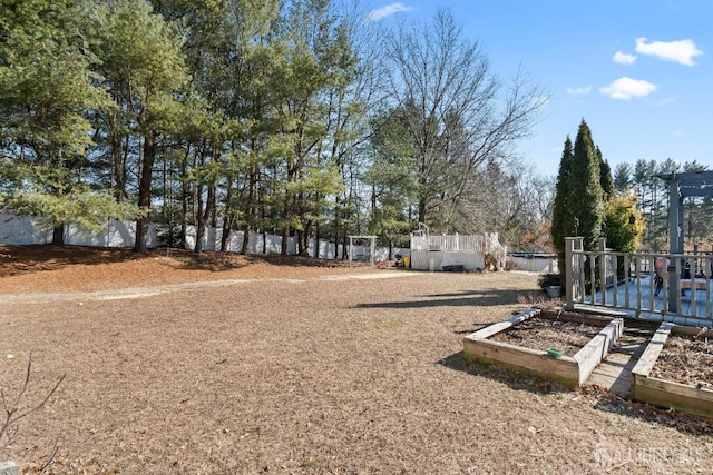 view of yard featuring a garden and fence