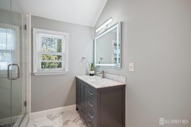 full bathroom with a stall shower, baseboards, lofted ceiling, marble finish floor, and vanity