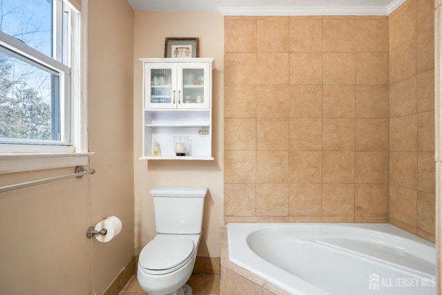 full bathroom with a garden tub and toilet