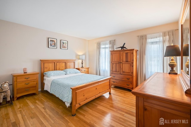 bedroom with light wood-type flooring