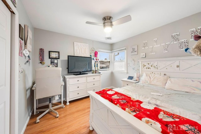 bedroom with ceiling fan and light wood-type flooring